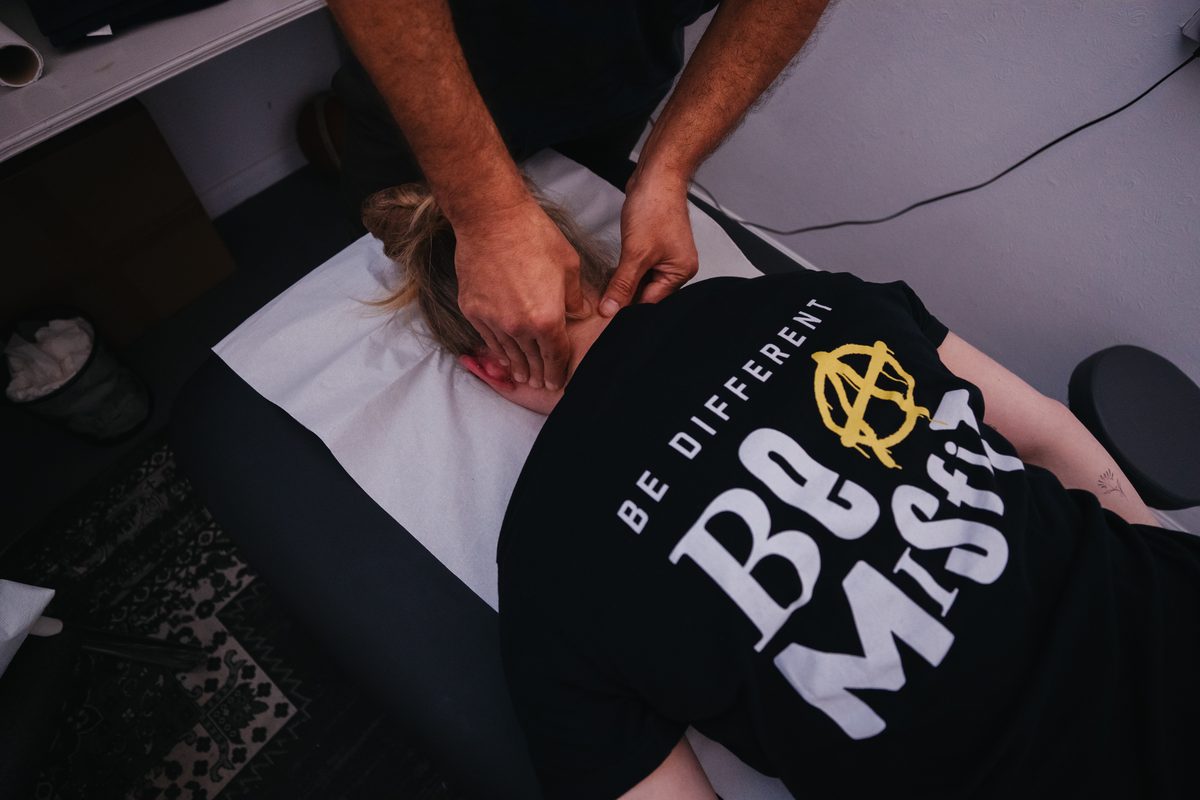 Hands-on soft-tissue treatment to the neck and shoulders